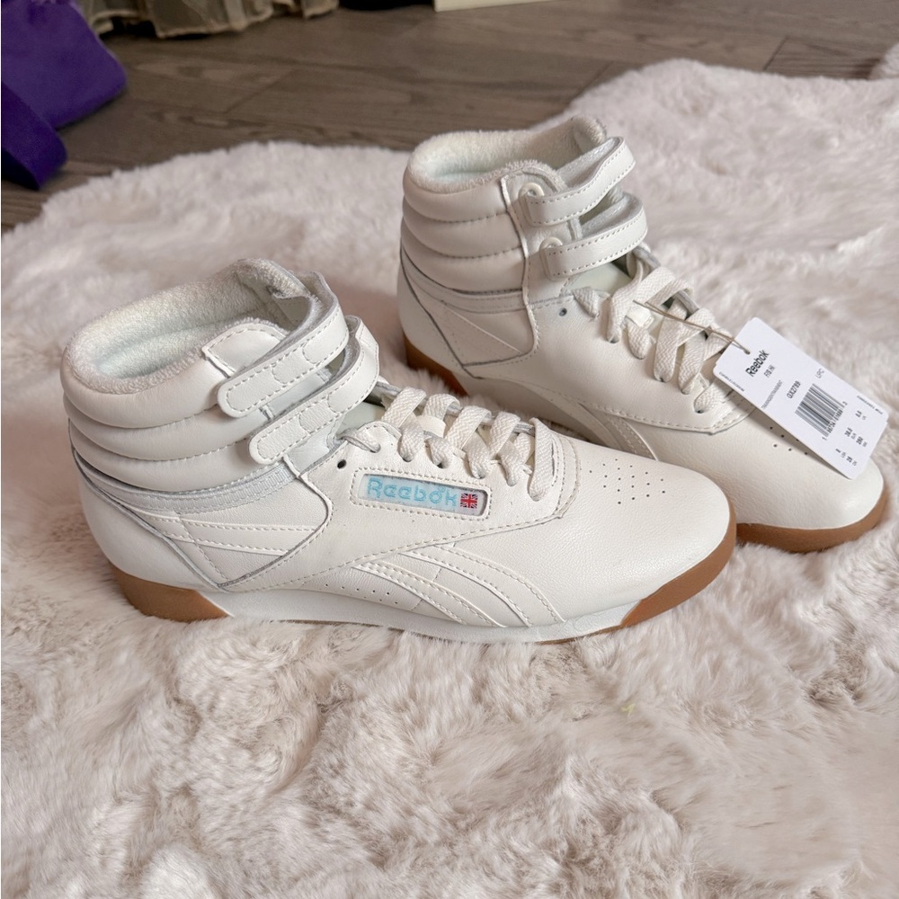 Reebok high tops. Never worn. Tag still on.